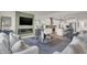 Cozy living room featuring a modern fireplace, comfortable seating, and an open connection to the kitchen at 11612 Aubrey Ln, Fishers, IN 46040