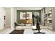 Home gym with modern exercise equipment, mirrored wall, and stylish decor at 11641 Aubrey Ln, Fishers, IN 46040