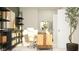 Home office with wood desk, shelving, decor, and light streaming through windows at 11641 Aubrey Ln, Fishers, IN 46040