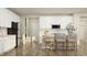 A modern white kitchen with stainless steel appliances, island seating, and ample cabinets at 11641 Aubrey Ln, Fishers, IN 46040