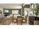 Open living space featuring a modern fireplace, TV, dining table, and chairs at 11641 Aubrey Ln, Fishers, IN 46040