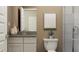 This is a bathroom with a toilet, sink, and a towel hanging from a bar at 11682 Aubrey Ln, Fishers, IN 46040