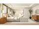 This bedroom features a cozy bed, seating area, dresser, stylish decor, and plenty of natural light at 11682 Aubrey Ln, Fishers, IN 46040