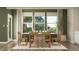The dining area is bright with natural light and features wooden chairs, a sleek white table, and stylish decor at 11682 Aubrey Ln, Fishers, IN 46040