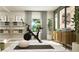 Home gym featuring weights, yoga mat, bike and a storage cabinet at 11682 Aubrey Ln, Fishers, IN 46040