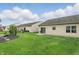 Spacious backyard featuring lush green grass, perfect for outdoor entertaining and relaxation at 11716 Whisper Cove Dr, Fishers, IN 46037