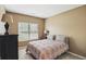 Comfortable bedroom with a window view at 11716 Whisper Cove Dr, Fishers, IN 46037