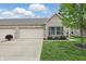 Beautiful home featuring a brick facade, well-kept lawn, and a convenient two-car garage at 11716 Whisper Cove Dr, Fishers, IN 46037