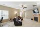 Spacious living room with a cozy fireplace, comfortable seating, and an open floor plan at 11716 Whisper Cove Dr, Fishers, IN 46037