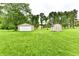 Expansive backyard featuring a detached garage and additional storage shed at 12087 N Gasburg Rd, Mooresville, IN 46158