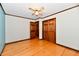Bedroom featuring wood floors, doors to closets and halls, ceiling fan and neutral colored walls at 12087 N Gasburg Rd, Mooresville, IN 46158