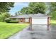 Brick ranch-style home with attached garage and a well-maintained front lawn at 12087 N Gasburg Rd, Mooresville, IN 46158