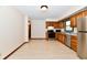 Functional kitchen with stainless steel appliances and wood cabinetry at 12087 N Gasburg Rd, Mooresville, IN 46158
