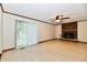 Bright living room with a brick fireplace and sliding doors to the backyard at 12087 N Gasburg Rd, Mooresville, IN 46158