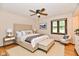 Serene main bedroom with a plush upholstered headboard, bench, and natural light at 12087 N Gasburg Rd, Mooresville, IN 46158