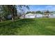 Spacious backyard featuring lush green grass and an oversized detached two-car garage at 1254 S Leland Ave, Indianapolis, IN 46203