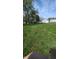 A spacious backyard featuring lush green grass and a detached two-car garage at 1254 S Leland Ave, Indianapolis, IN 46203