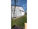 Detached garage with a closed bay door and a side entrance, providing secure storage at 1254 S Leland Ave, Indianapolis, IN 46203