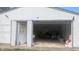 Detached garage with an open door, providing ample space for parking and storage at 1254 S Leland Ave, Indianapolis, IN 46203