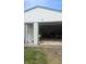 Detached garage with an open door, offering plenty of space for parking and storage at 1254 S Leland Ave, Indianapolis, IN 46203