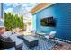 Outdoor living with patio, built-in fire pit and TV at 12605 Branford St, Carmel, IN 46032