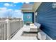 Balcony with a white railing and cushioned lounge chair at 12605 Branford St, Carmel, IN 46032