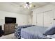 Comfortable bedroom with carpet, ceiling fan, TV and dresser at 12605 Branford St, Carmel, IN 46032