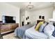 Serene bedroom boasts hardwood floors, stylish decor, and ample natural light at 12605 Branford St, Carmel, IN 46032