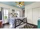 Charming bedroom with patterned rug, ceiling fan and black iron bed frame at 12605 Branford St, Carmel, IN 46032