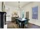 Bright dining room showcasing hardwood floors and a stylish chandelier at 12605 Branford St, Carmel, IN 46032