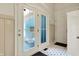 Bright entryway features double doors, patterned tile floor, and white trim throughout at 12605 Branford St, Carmel, IN 46032