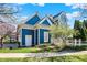 Beautiful home exterior featuring blue siding and professional landscaping at 12605 Branford St, Carmel, IN 46032