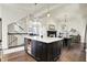 Open kitchen with a large island, ideal for cooking and entertaining at 12605 Branford St, Carmel, IN 46032