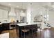 Modern kitchen with stainless steel appliances, island with seating, and white cabinets at 12605 Branford St, Carmel, IN 46032