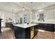 Spacious kitchen featuring a large island with seating and a dining area at 12605 Branford St, Carmel, IN 46032