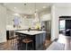 Well-appointed kitchen with stainless steel appliances and a large island at 12605 Branford St, Carmel, IN 46032