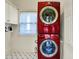 Functional laundry room with stacked washer and dryer unit at 12605 Branford St, Carmel, IN 46032
