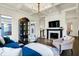 Cozy living room with a fireplace, dark wood floors, stylish furnishings, and modern decor, perfect for relaxing at 12605 Branford St, Carmel, IN 46032