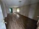 Spacious living room with wood-look flooring, offering a versatile and inviting space at 1354 Roache St, Indianapolis, IN 46208