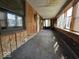 Sun room lined with windows and wood paneling, providing a unique space for relaxation at 1354 Roache St, Indianapolis, IN 46208
