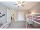 Bright bedroom with a bunk bed, carpet, and a doorway leading to other areas of the home at 14153 Jasmine Ct, Fishers, IN 46038