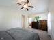 Spacious bedroom with ceiling fan, neutral carpet and vaulted ceiling, and en-suite bathroom access at 14153 Jasmine Ct, Fishers, IN 46038
