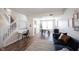 Dining room showcases modern decor, stylish furniture, hardwood floors, and a staircase nearby at 14153 Jasmine Ct, Fishers, IN 46038