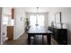 Elegant dining room with modern decor, a wooden table, and plenty of natural light at 14153 Jasmine Ct, Fishers, IN 46038