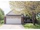Charming two-story home with a brick facade, a two-car garage, and a well-manicured lawn at 14153 Jasmine Ct, Fishers, IN 46038