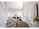 Bright foyer with a staircase, wooden floors, a decorative rug, and a front door at 14153 Jasmine Ct, Fishers, IN 46038