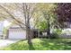 Charming two-story home with a brick facade, attached two-car garage, and well-manicured lawn at 14153 Jasmine Ct, Fishers, IN 46038