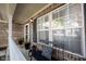 Cozy front porch features a black bench, throw pillow, decor, and large windows for natural light at 14153 Jasmine Ct, Fishers, IN 46038