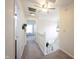 Hallway with carpet flooring and ceiling fan leads to stairway, bedrooms and bathroom at 14153 Jasmine Ct, Fishers, IN 46038