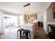 Eat-in kitchen with wood cabinets, center island with seating, and sliding doors leading to a patio at 14153 Jasmine Ct, Fishers, IN 46038